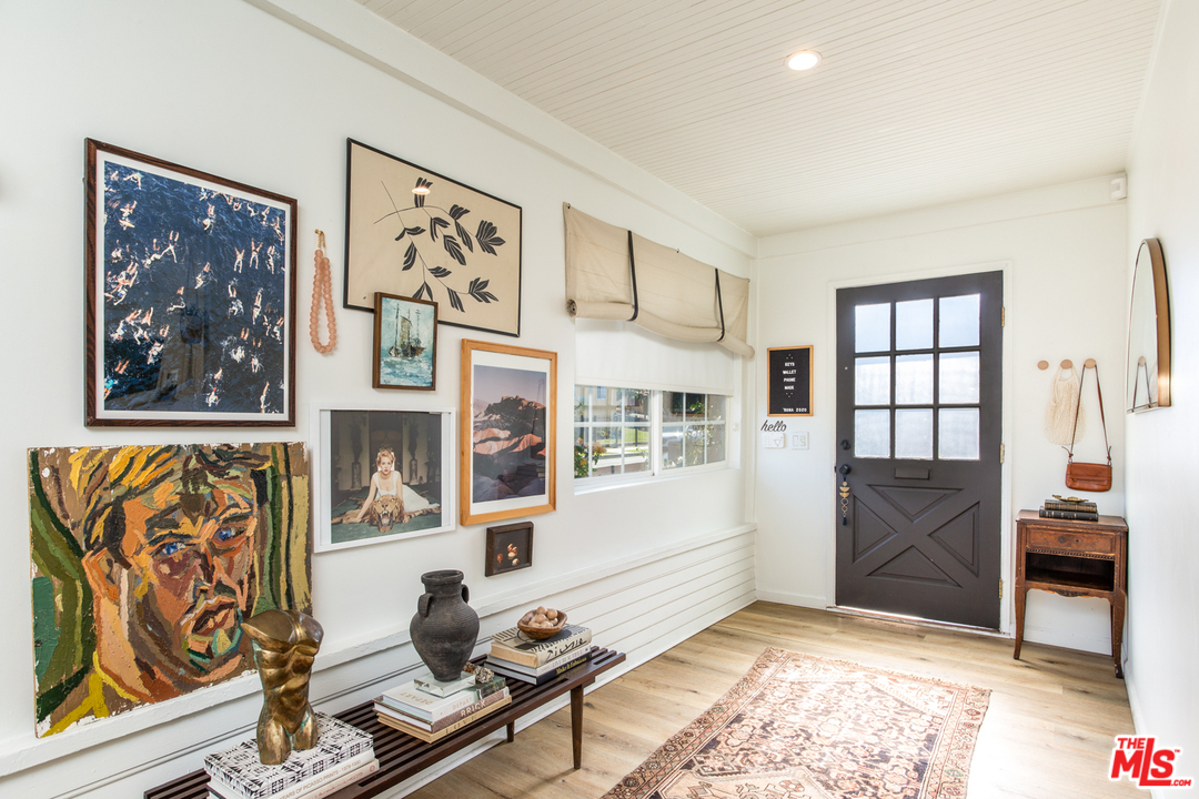 1663 South Rimpau Boulevard Los Angeles, CA 90019 - Photo 2 of 21 a living room with furniture and window