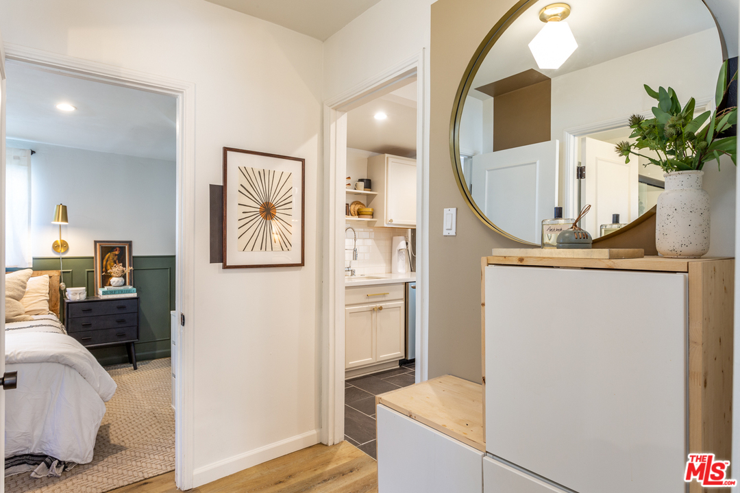 1663 South Rimpau Boulevard Los Angeles, CA 90019 - Photo 12 of 21 a view of hallway with furniture and a potted plant