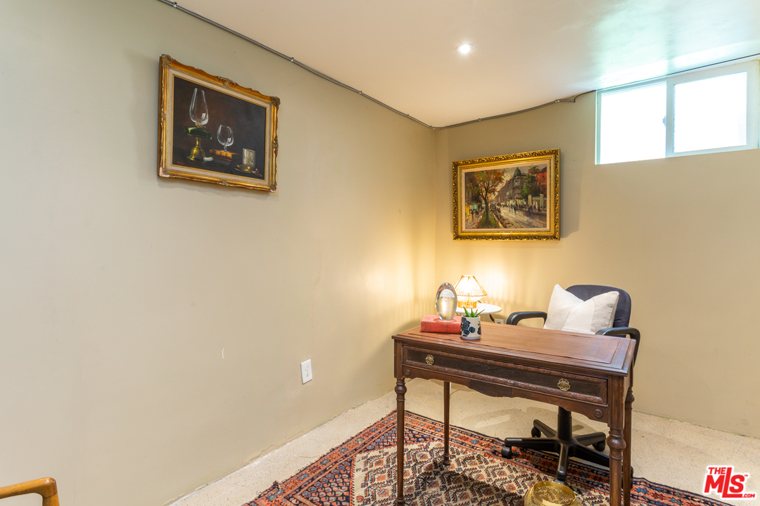 1663 South Rimpau Boulevard Los Angeles, CA 90019 - Photo 18 of 21 a view of a workspace with furniture