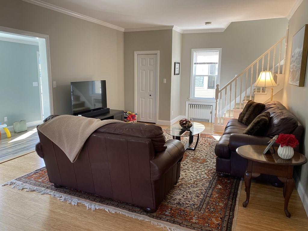 230 Green Street Fairhaven, MA 02719 - Photo 6 of 22 a living room with furniture a rug and a lamp