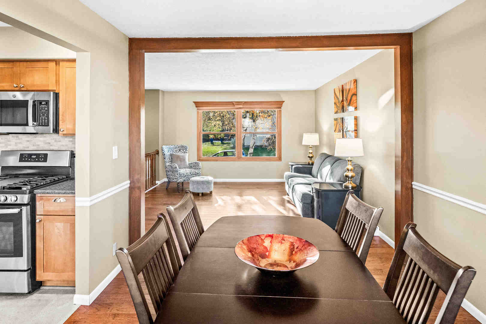 308 Raleigh Court Normal, IL 61761 - Photo 13 of 40 a view of a dining room with furniture a chandelier and wooden floor