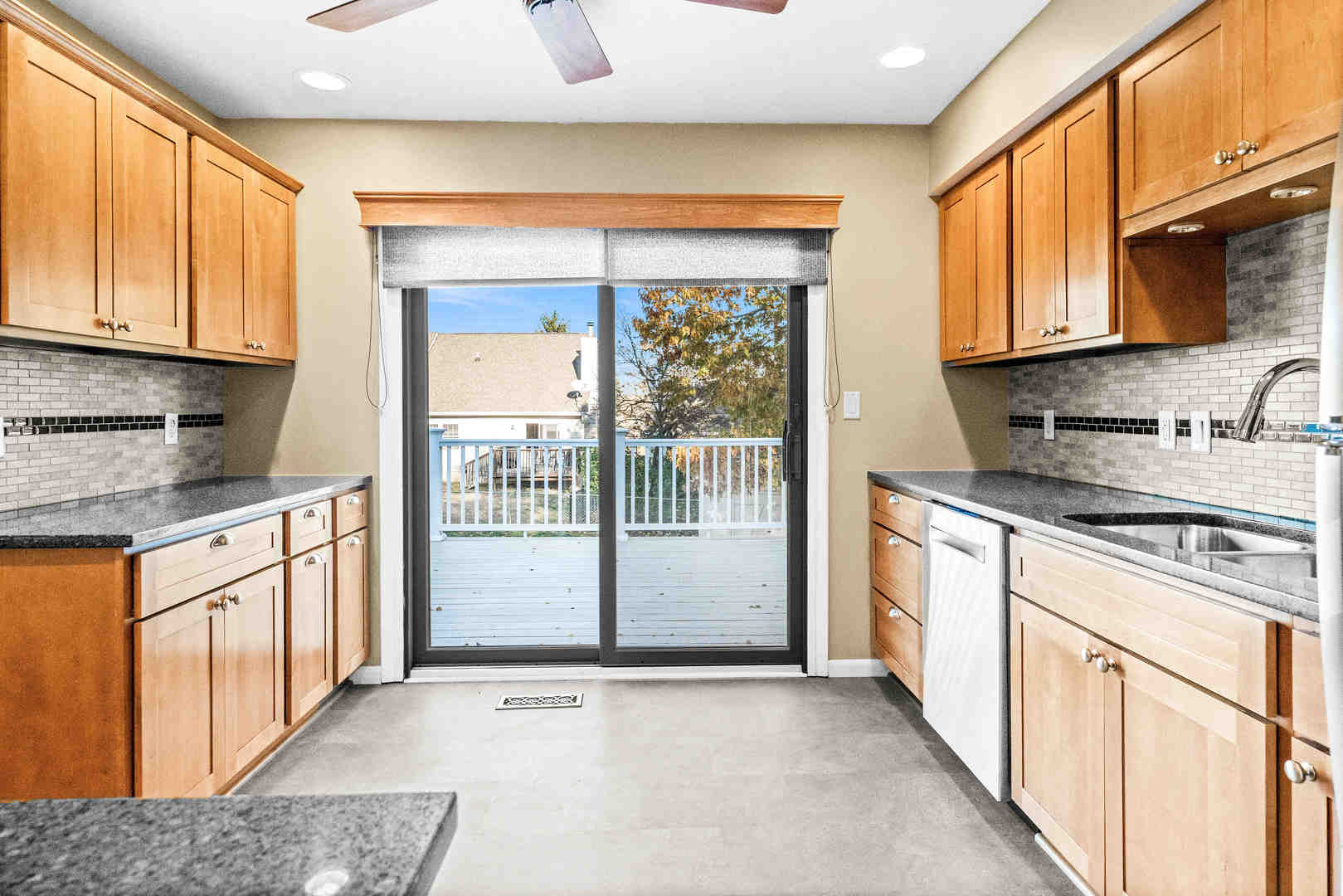308 Raleigh Court Normal, IL 61761 - Photo 16 of 40 a kitchen with stainless steel appliances granite countertop a stove a sink and a microwave