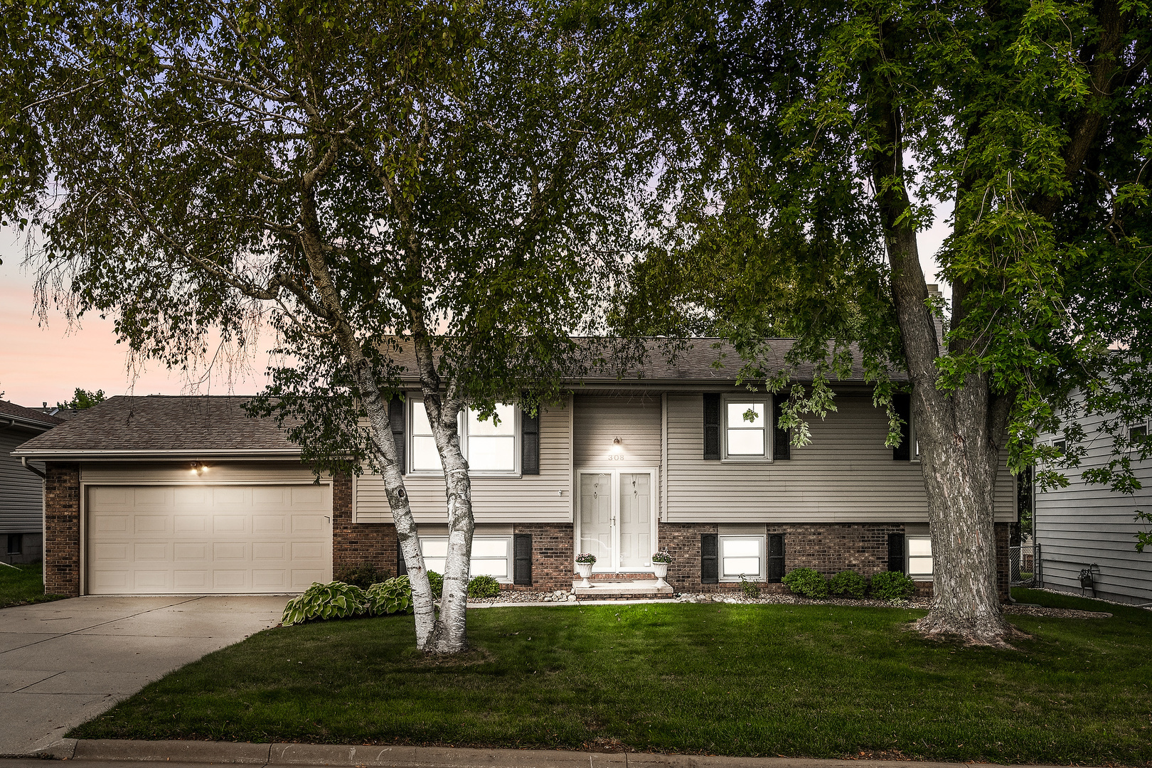308 Raleigh Court Normal, IL 61761 - Photo 2 of 40 a front view of a house with a yard and garage