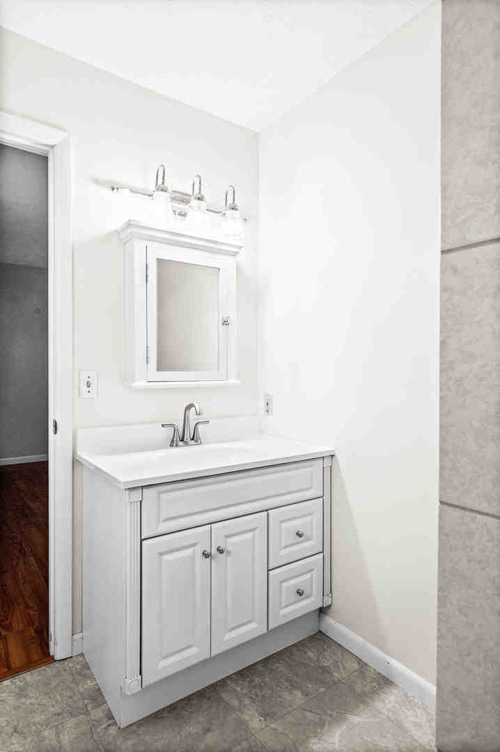 308 Raleigh Court Normal, IL 61761 - Photo 24 of 40 a bathroom with a sink and a mirror