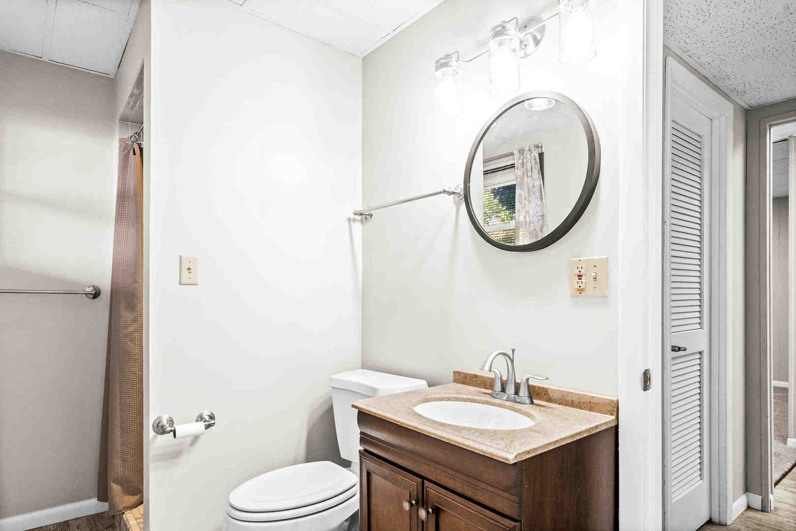308 Raleigh Court Normal, IL 61761 - Photo 29 of 40 a bathroom with a toilet a sink and a mirror