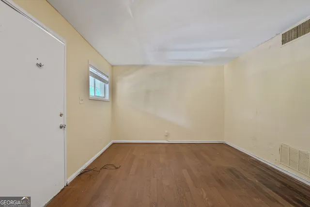 a view of a room that has a window in it