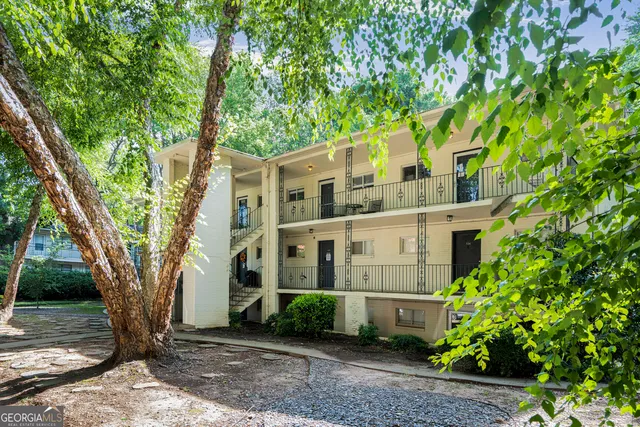 front view of a house with a tree
