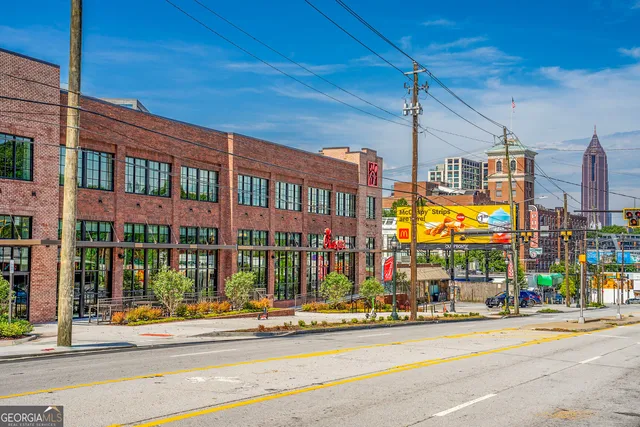 a view of a building with a street
