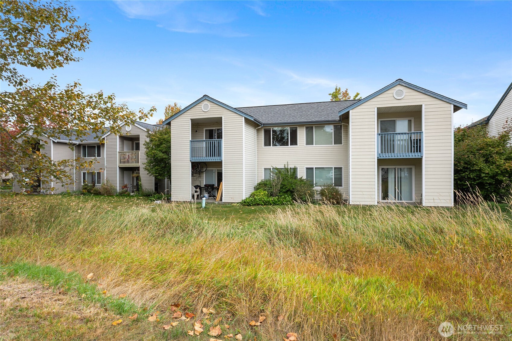641 West Horton Way, Unit 230 Bellingham, WA 98226 - Photo 2 of 24 a front view of house with yard and trees in the background