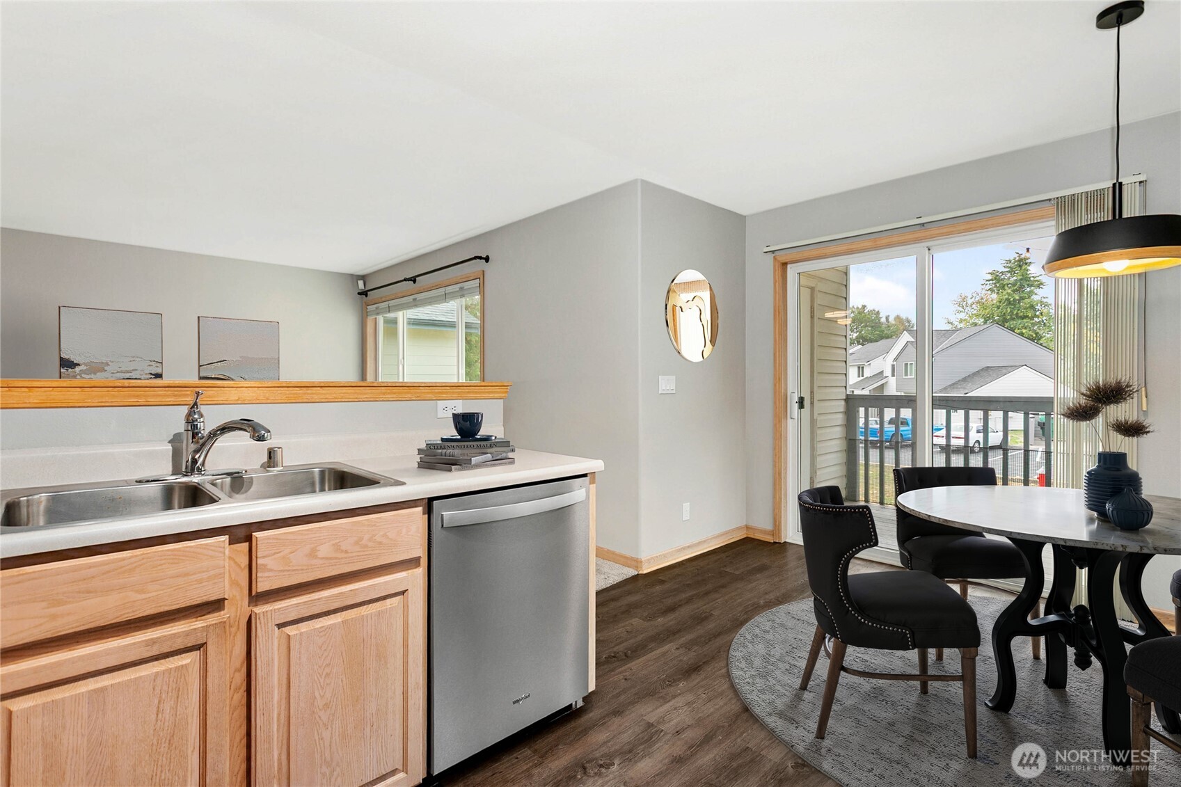 641 West Horton Way, Unit 230 Bellingham, WA 98226 - Photo 9 of 24 a kitchen with stainless steel appliances granite countertop a sink and dishwasher a refrigerator with wooden floor