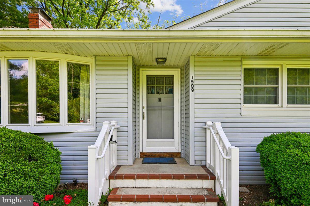 1509 Duvall Road Annapolis, MD 21409 - Photo 14 of 39 a front view of a house with a balcony