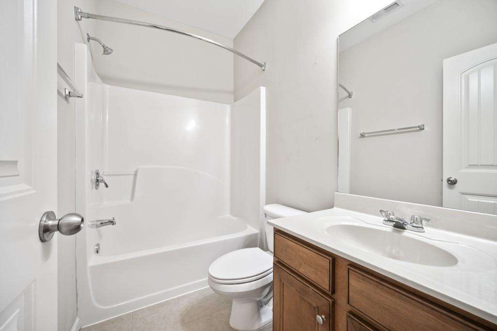 100 Trailside Way Hiram, GA 30141 - Photo 21 of 28 a bathroom with a sink toilet tub and shower