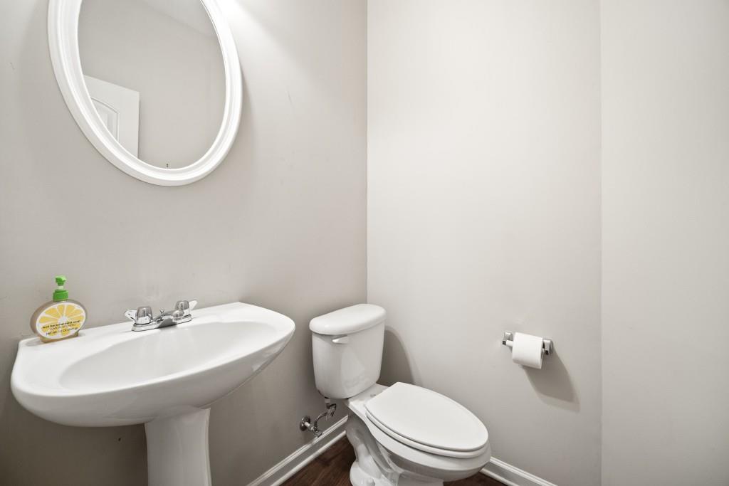 100 Trailside Way Hiram, GA 30141 - Photo 3 of 28 a white toilet sitting next to a bathroom sink