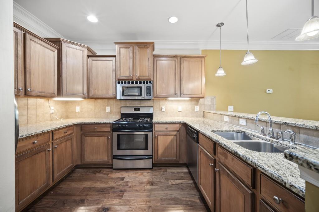 100 Trailside Way Hiram, GA 30141 - Photo 5 of 28 a kitchen with a sink stove top oven and cabinets
