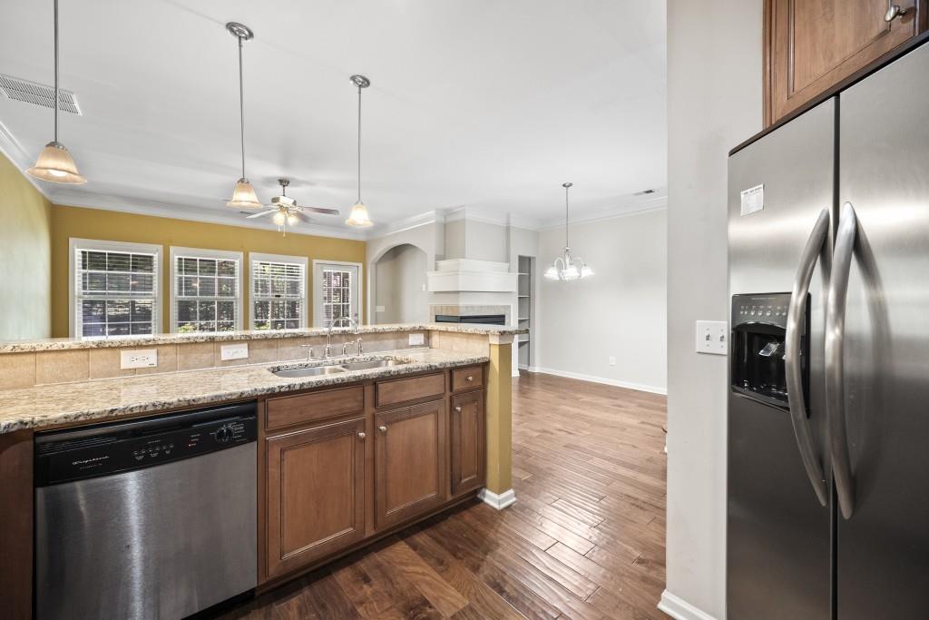100 Trailside Way Hiram, GA 30141 - Photo 7 of 28 a kitchen with granite countertop a stove and a sink