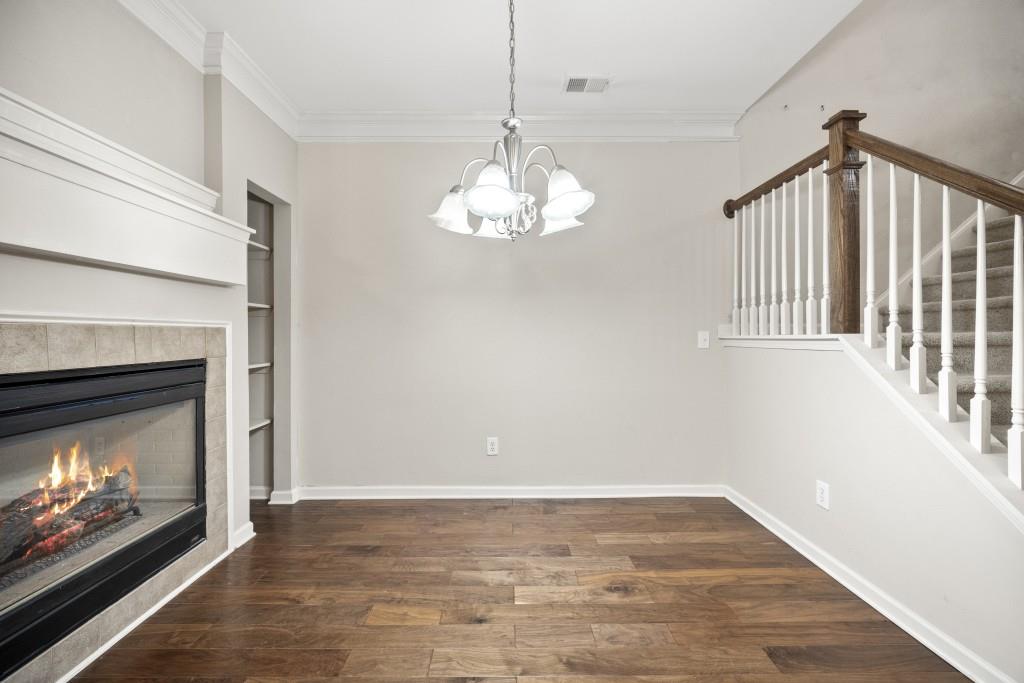 100 Trailside Way Hiram, GA 30141 - Photo 8 of 28 a view of an empty room with wooden floor fireplace and a window