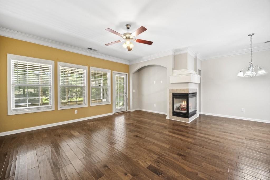 100 Trailside Way Hiram, GA 30141 - Photo 10 of 28 a view of an empty room with wooden floor and a fireplace