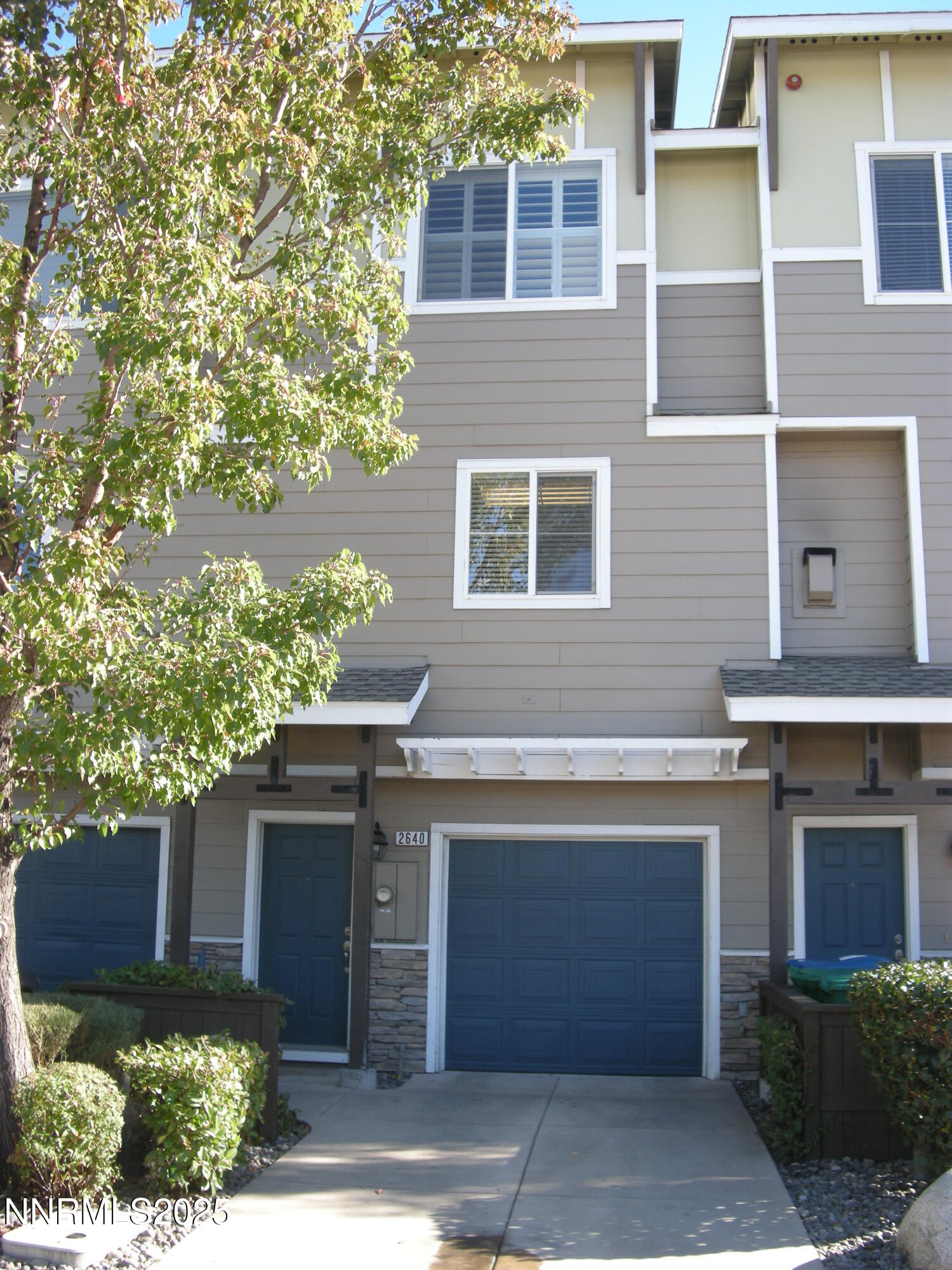 2640 Dana Kristin Lane Reno, NV 89503 - Photo 1 of 24 a front view of a house with a yard and garage