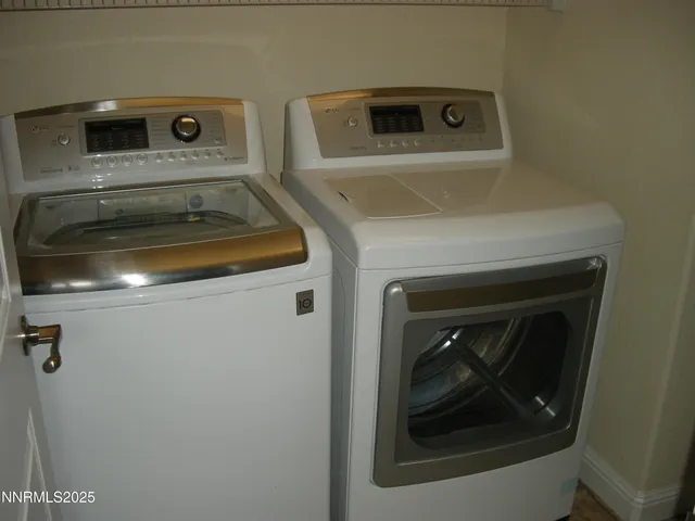 a bath room with a toilet and a bath tub