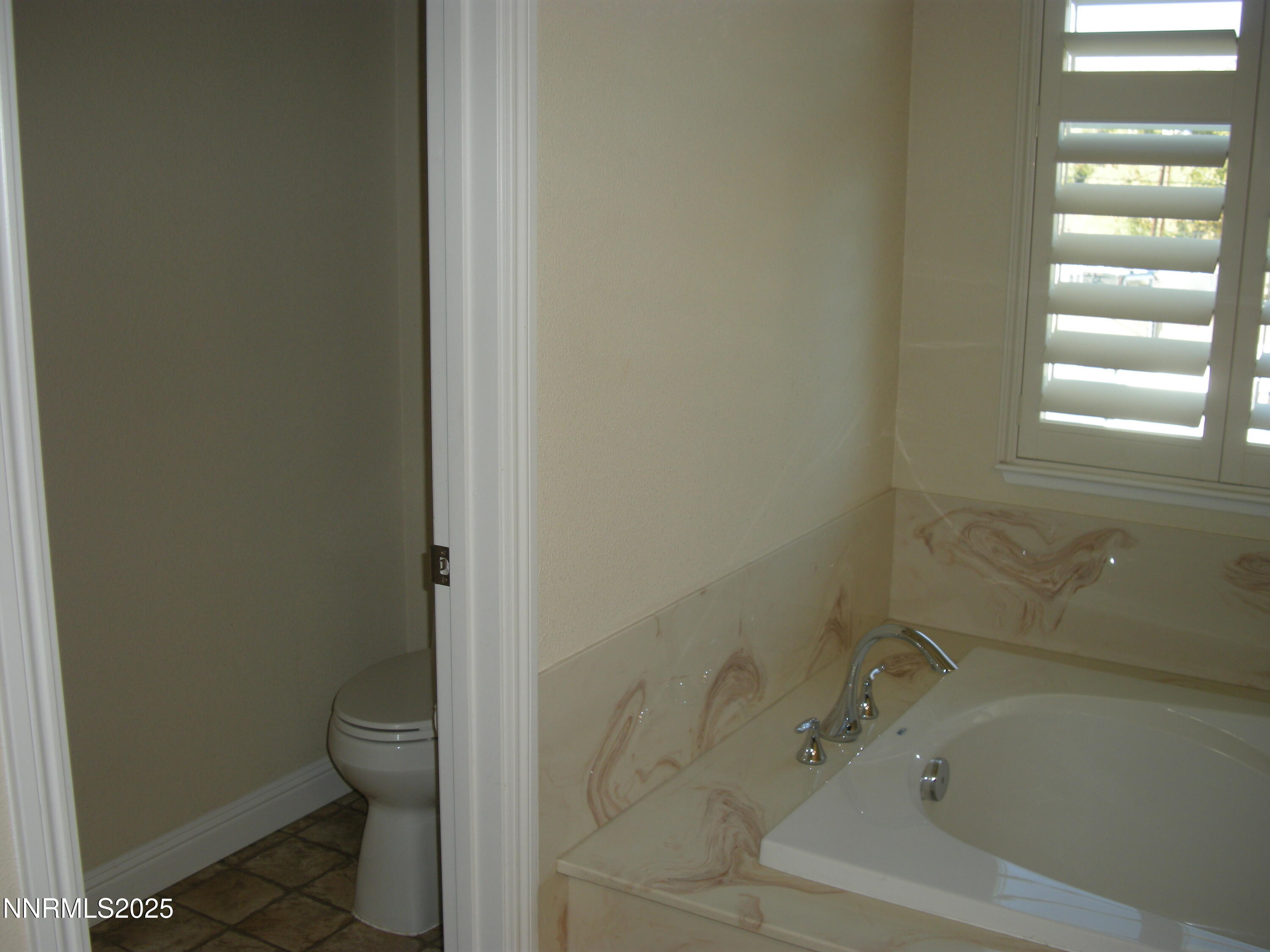 2640 Dana Kristin Lane Reno, NV 89503 - Photo 16 of 24 a bath room with a toilet and a bath tub