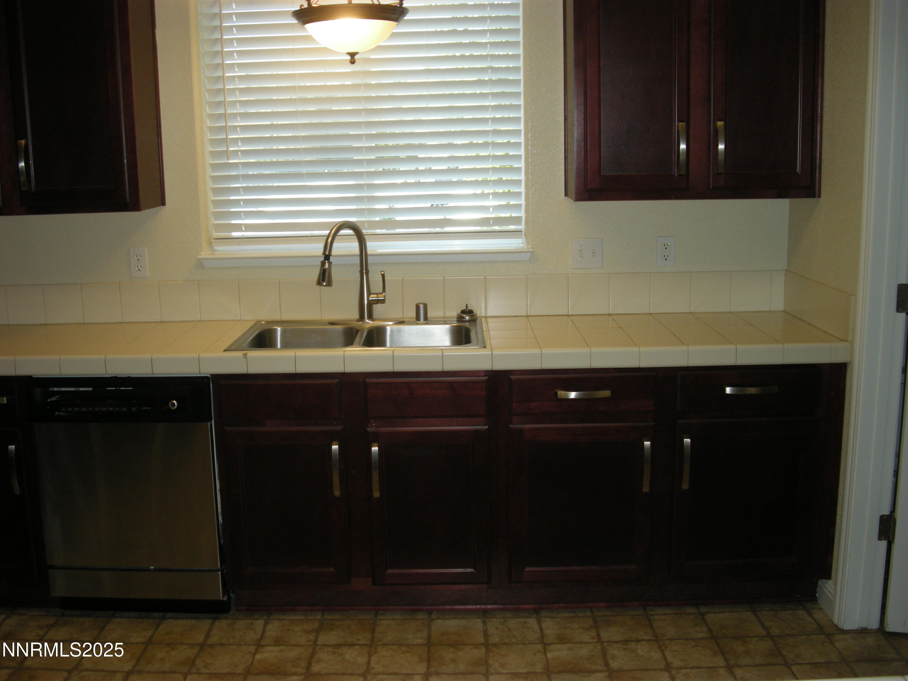 2640 Dana Kristin Lane Reno, NV 89503 - Photo 22 of 24 a kitchen with a sink and cabinets