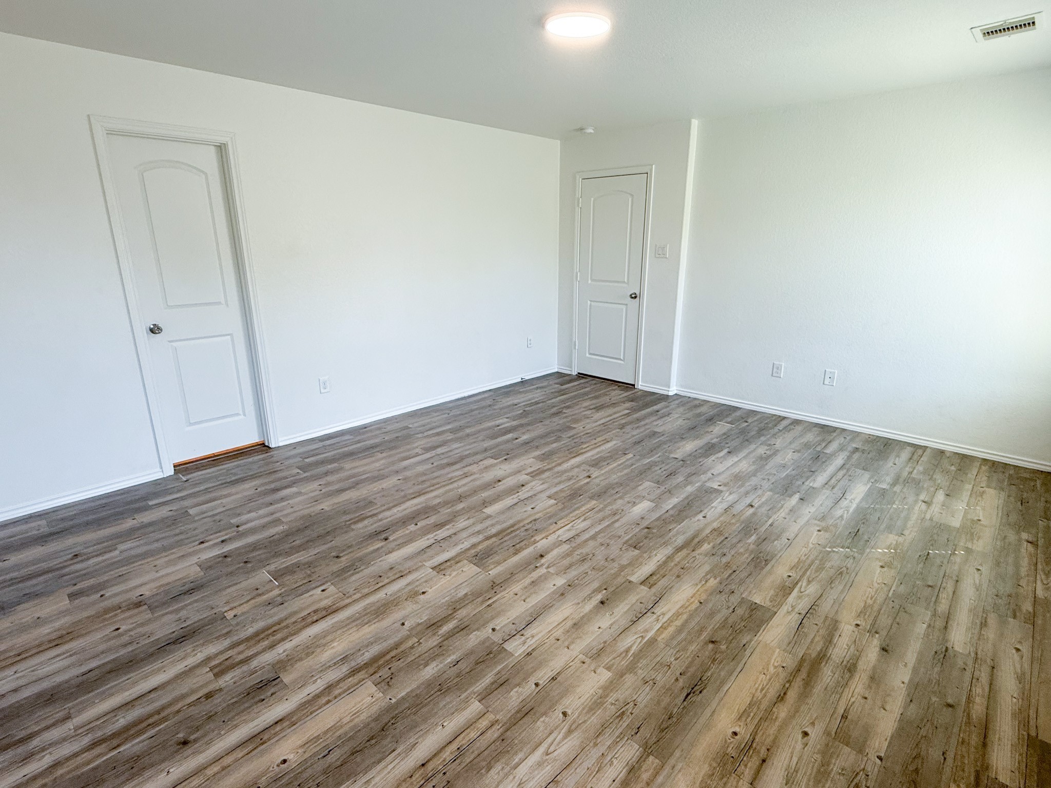 23319 Robbers Nest Drive Spring, TX 77373 - Photo 31 of 42 a view of an empty room with wooden floor