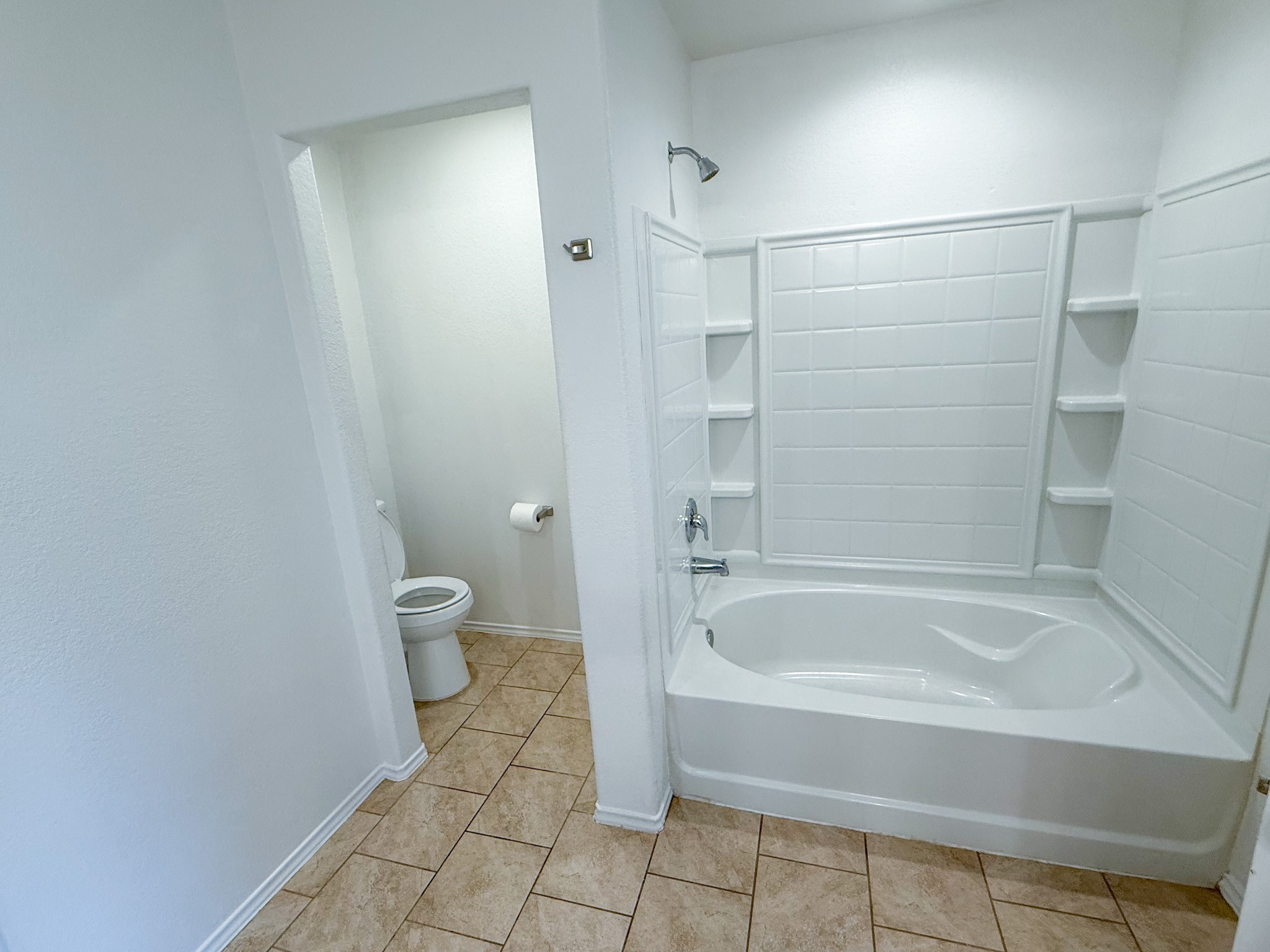 23319 Robbers Nest Drive Spring, TX 77373 - Photo 33 of 42 a spacious bathroom with a bathtub and toilet
