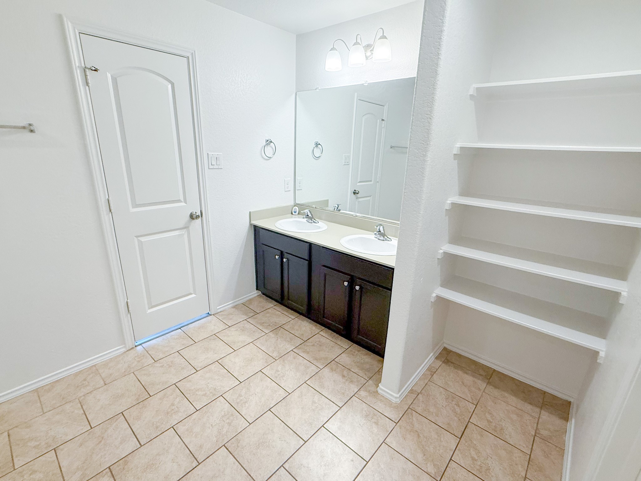 23319 Robbers Nest Drive Spring, TX 77373 - Photo 34 of 42 a bathroom with a sink and a mirror