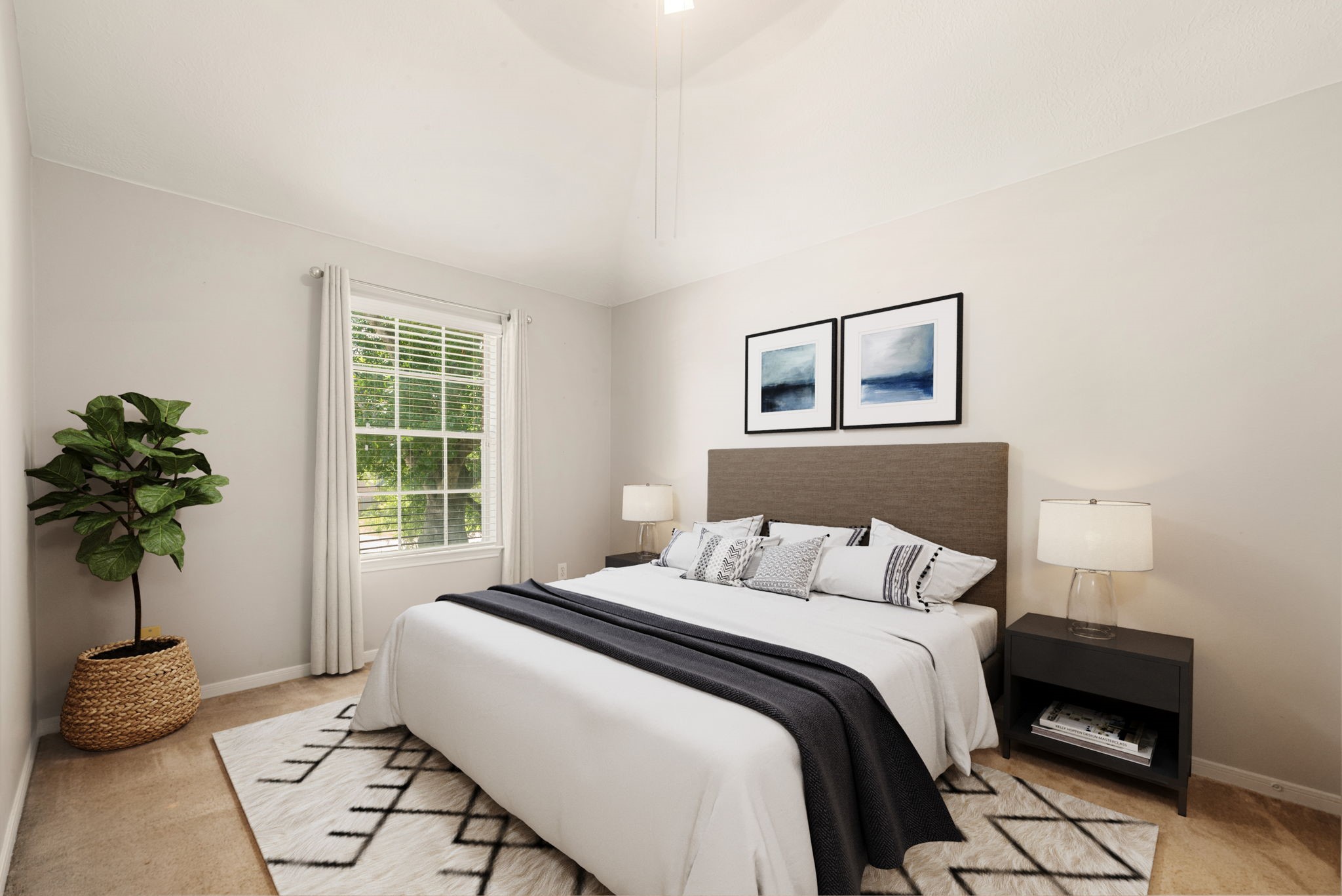 19726 Teller Boulevard Spring, TX 77388 - Photo 17 of 24 This light-filled guest bedroom offers a peaceful retreat with its soaring high ceilings and soft, neutral color palette. A large window with classic blinds overlooks lush greenery, bringing the beauty of the outdoors inside. Featuring warm wood-look flooring and ample space for a full bedroom suite, this room is perfect for family or friends to relax in total comfort.