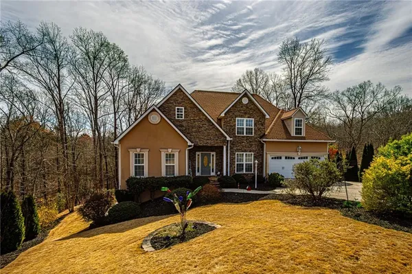 a front view of a house with garden