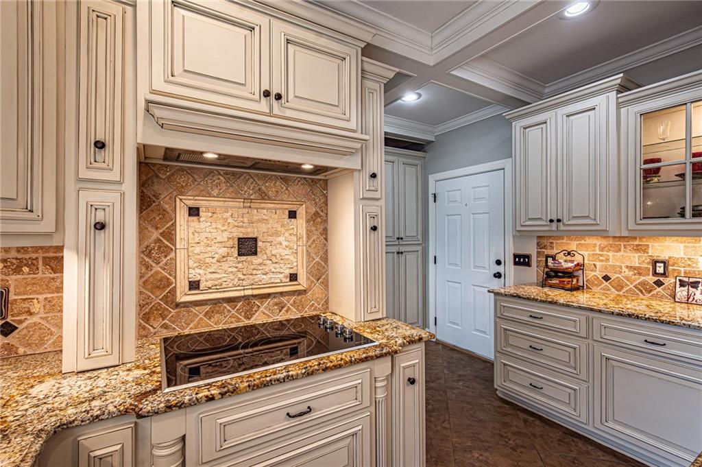 3718 Pebble Creek Point Gainesville, GA 30506 - Photo 12 of 144 a kitchen with granite countertop cabinets stainless steel appliances and a counter space