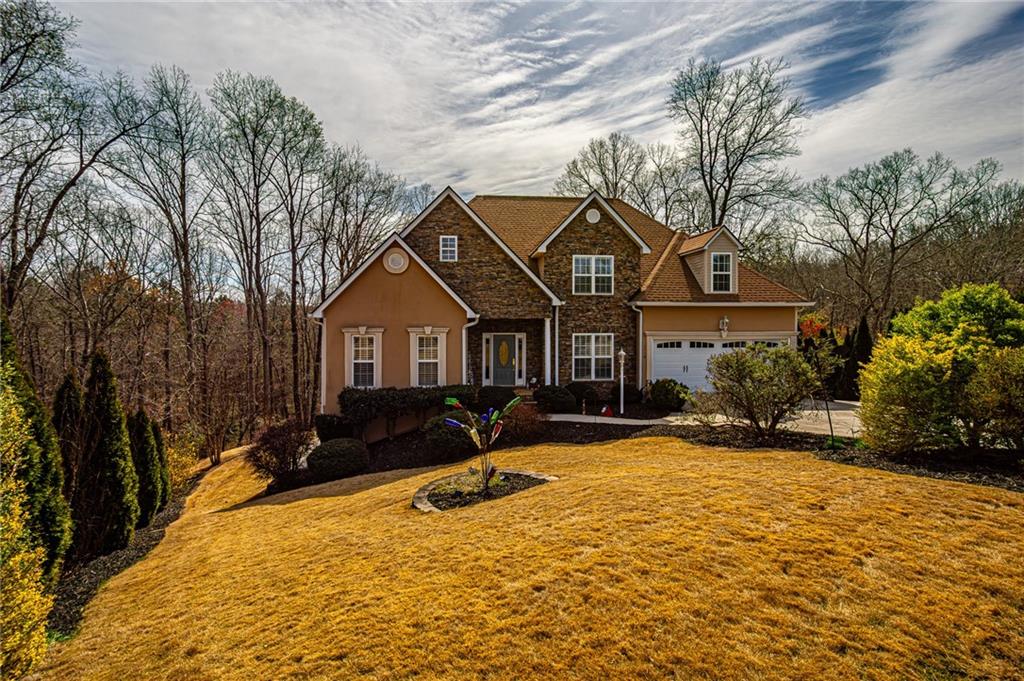 3718 Pebble Creek Point Gainesville, GA 30506 - Photo 139 of 144 a front view of house with yard and trees in the background