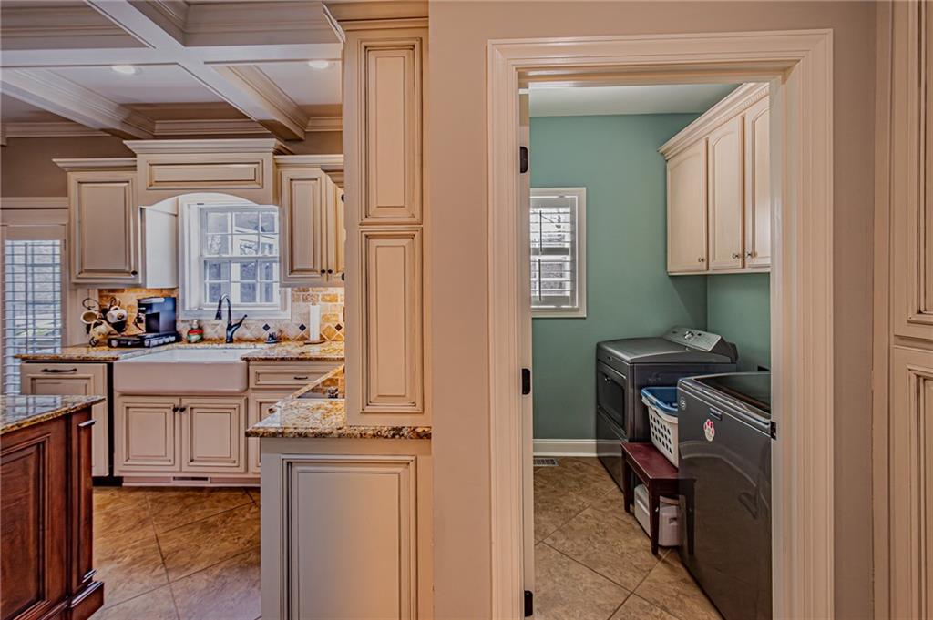 3718 Pebble Creek Point Gainesville, GA 30506 - Photo 16 of 144 a kitchen with stainless steel appliances granite countertop a stove and a refrigerator