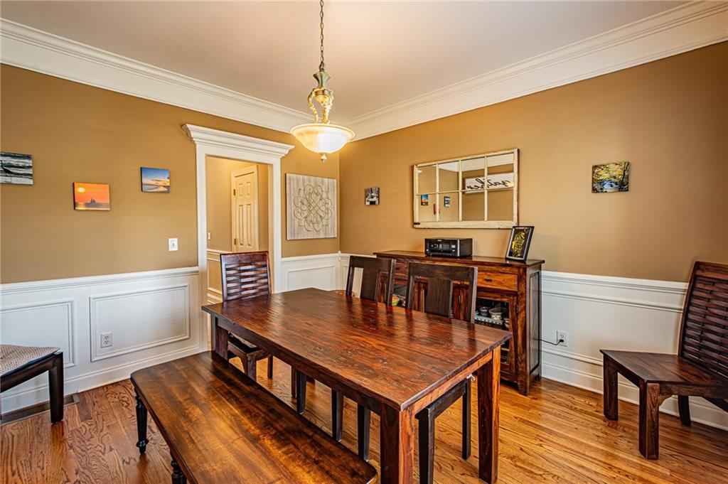 3718 Pebble Creek Point Gainesville, GA 30506 - Photo 36 of 144 a view of a dining room with furniture and wooden floor
