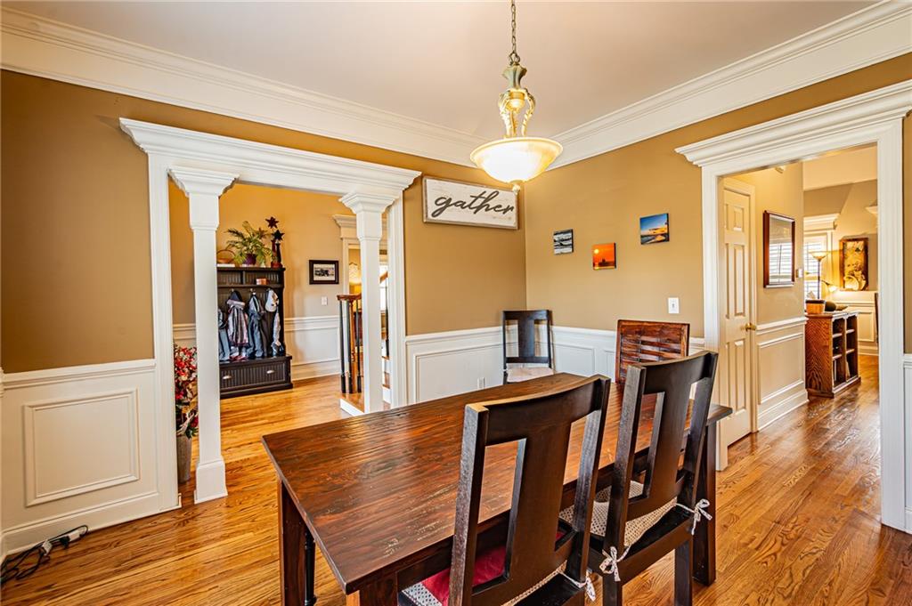 3718 Pebble Creek Point Gainesville, GA 30506 - Photo 37 of 144 a view of a dining room with furniture and wooden floor