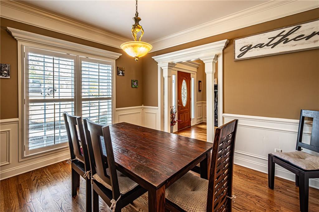 3718 Pebble Creek Point Gainesville, GA 30506 - Photo 38 of 144 a view of a dining room with furniture window and wooden floor