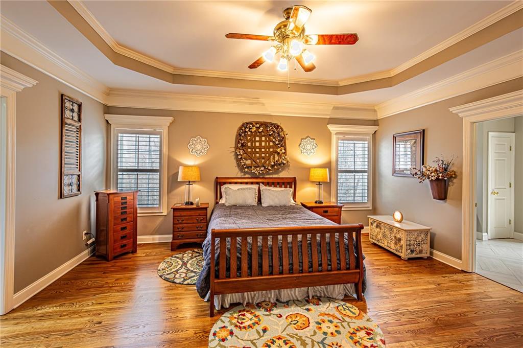 3718 Pebble Creek Point Gainesville, GA 30506 - Photo 40 of 144 a bedroom with a bed and wooden floor