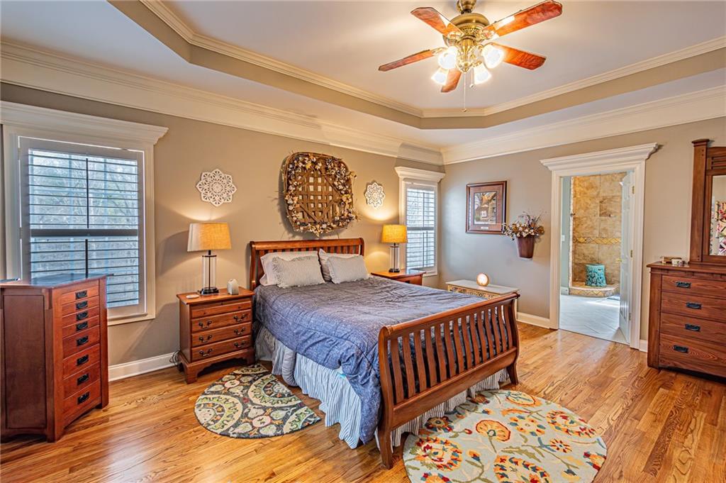 3718 Pebble Creek Point Gainesville, GA 30506 - Photo 42 of 144 a bedroom with a bed and wooden floor