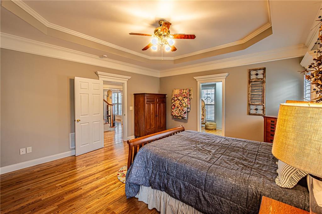 3718 Pebble Creek Point Gainesville, GA 30506 - Photo 44 of 144 a spacious bedroom with a bed and closet with wooden floor