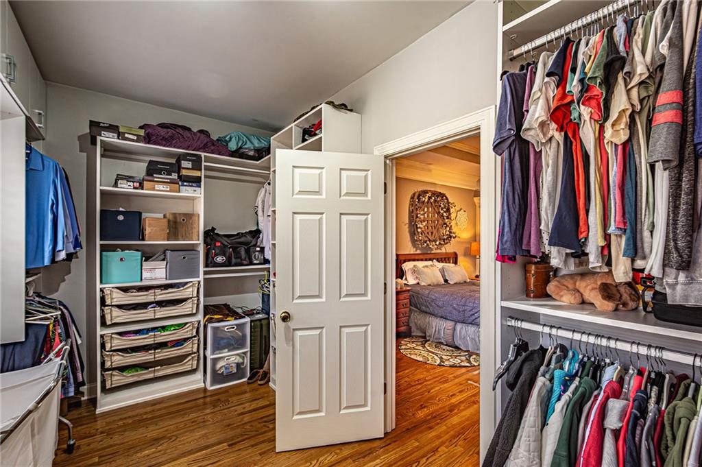 3718 Pebble Creek Point Gainesville, GA 30506 - Photo 46 of 144 a view of walk in closet with clothes and shoes