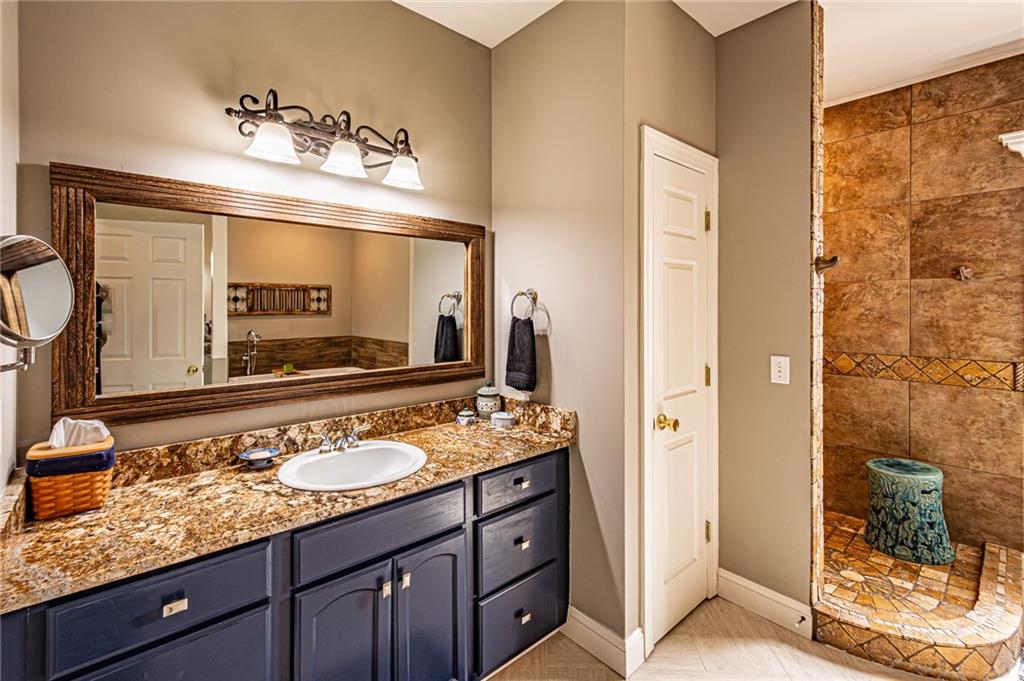 3718 Pebble Creek Point Gainesville, GA 30506 - Photo 48 of 144 a bathroom with a sink double vanity and a mirror