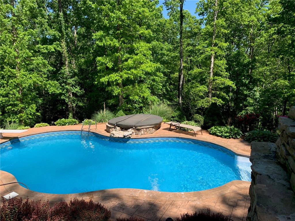 3718 Pebble Creek Point Gainesville, GA 30506 - Photo 5 of 144 a view of swimming pool with an outdoor space and seating area