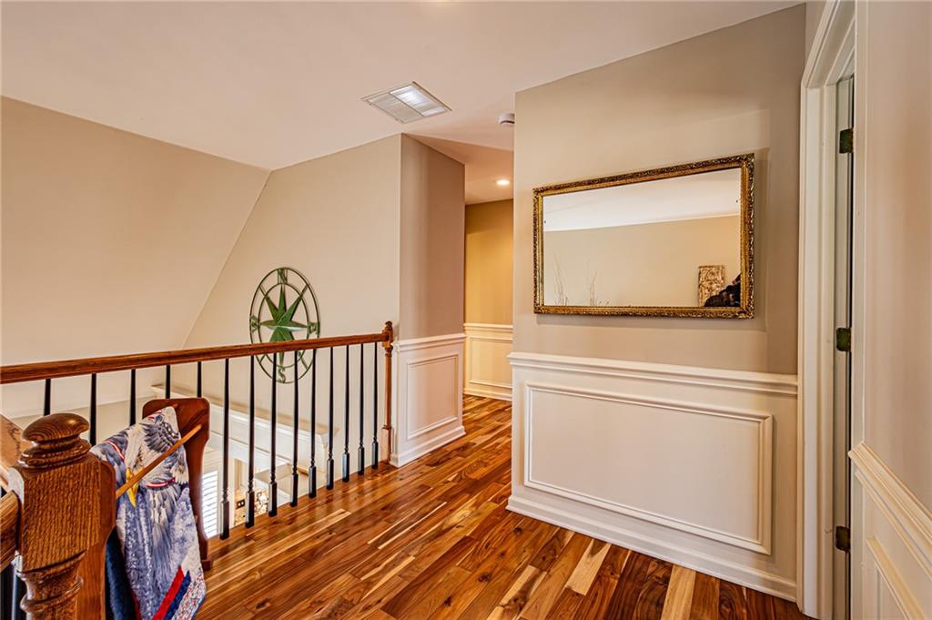 3718 Pebble Creek Point Gainesville, GA 30506 - Photo 57 of 144 a view of a hallway with wooden floor and a bathroom