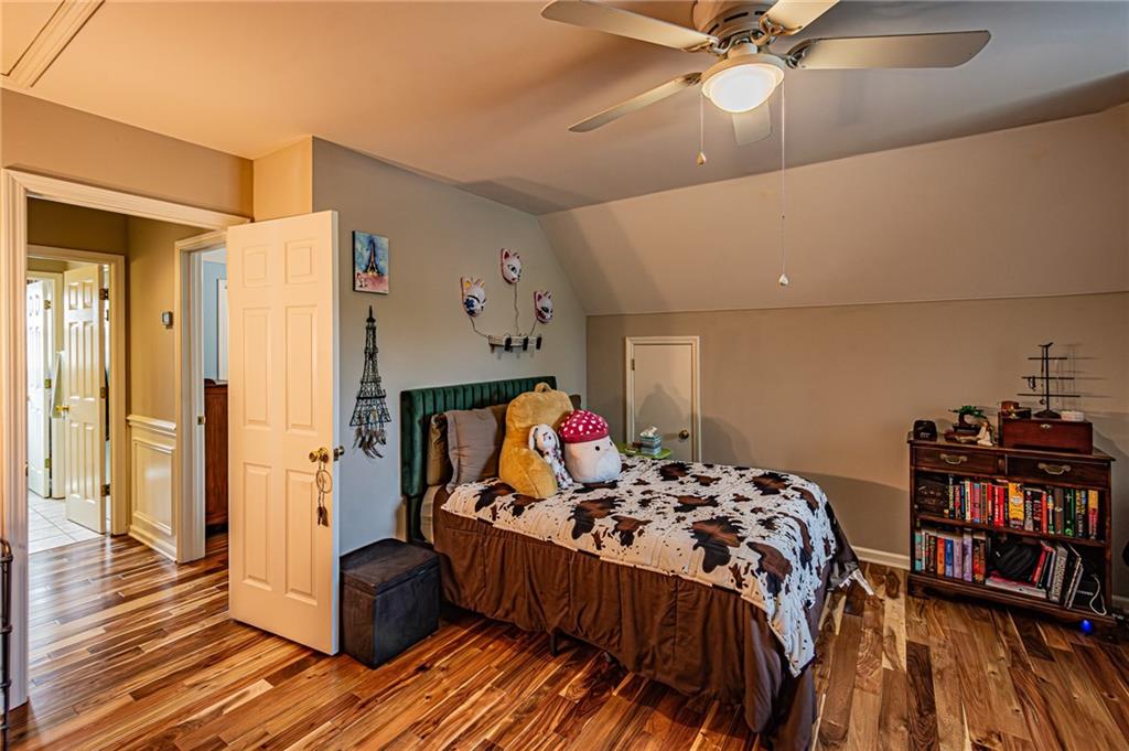 3718 Pebble Creek Point Gainesville, GA 30506 - Photo 61 of 144 a bed room with a bed and a book shelf