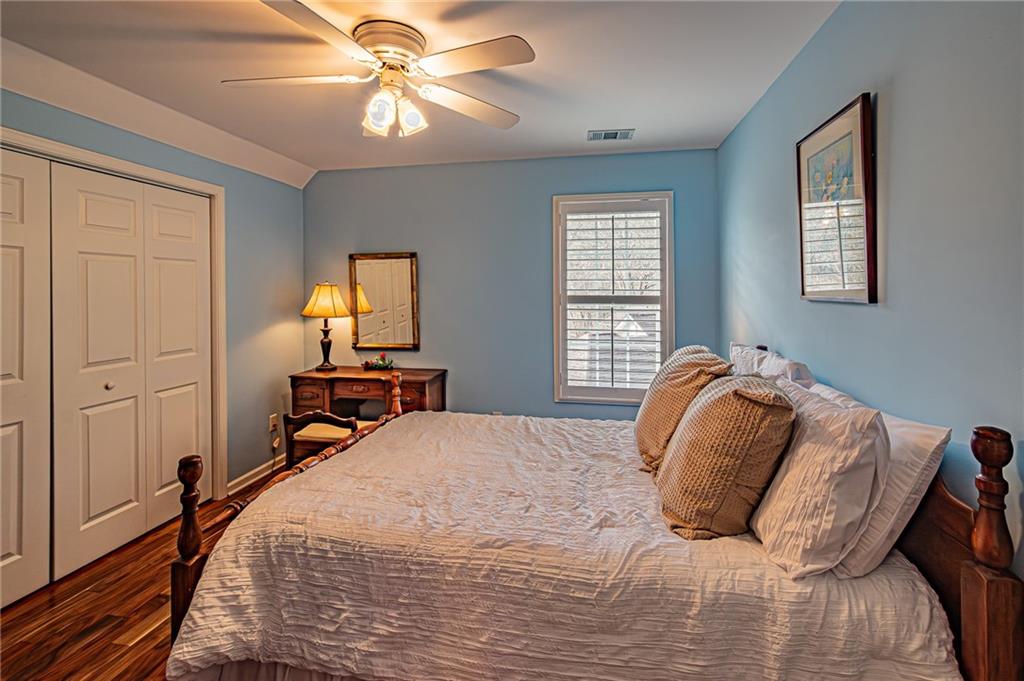 3718 Pebble Creek Point Gainesville, GA 30506 - Photo 64 of 144 a bedroom with a bed and a chandelier