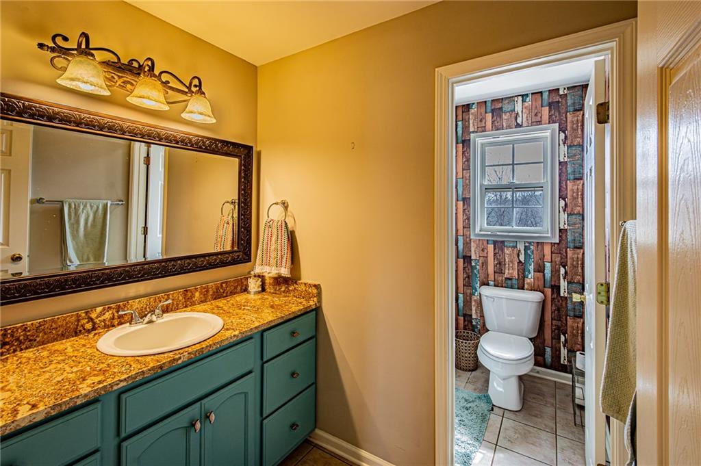 3718 Pebble Creek Point Gainesville, GA 30506 - Photo 67 of 144 a bathroom with a sink and a mirror
