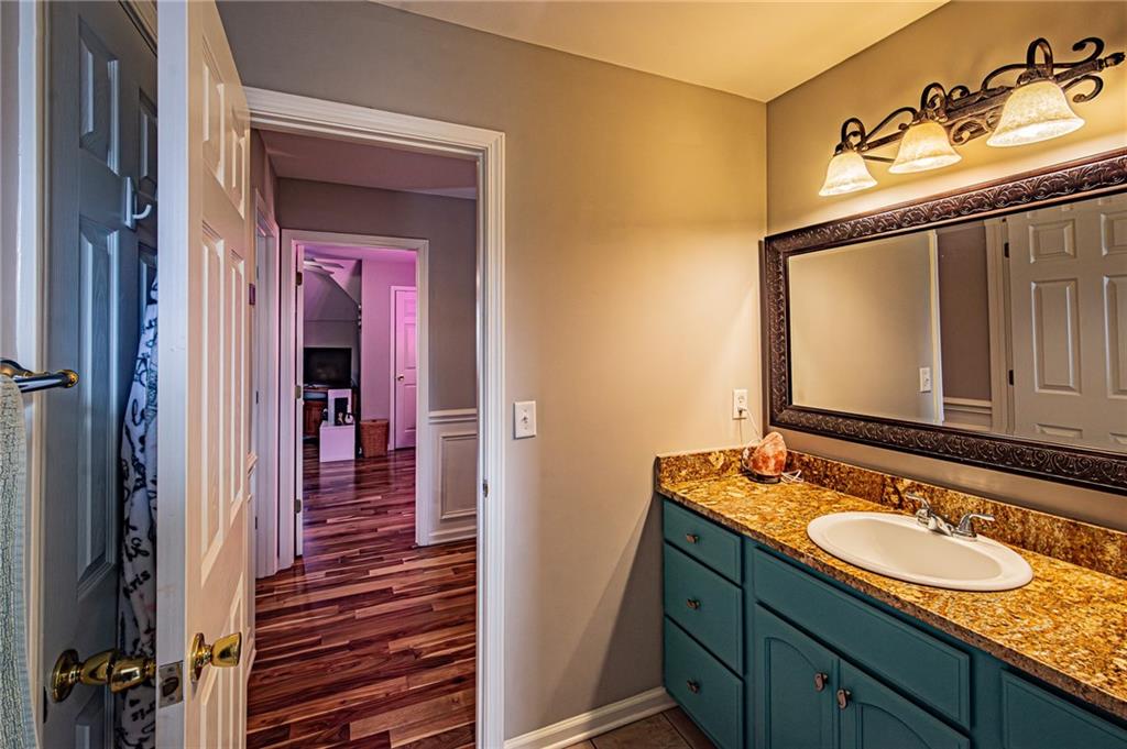 3718 Pebble Creek Point Gainesville, GA 30506 - Photo 69 of 144 a bathroom with a sink and a mirror