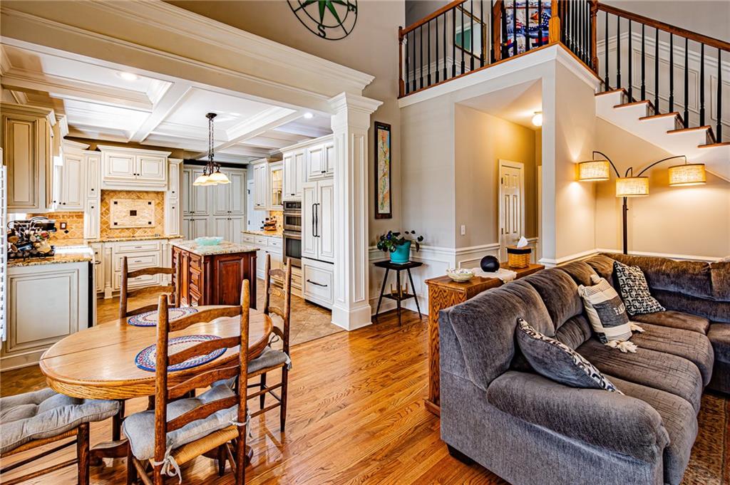 3718 Pebble Creek Point Gainesville, GA 30506 - Photo 70 of 144 a living room with furniture a wooden floor and next to a window