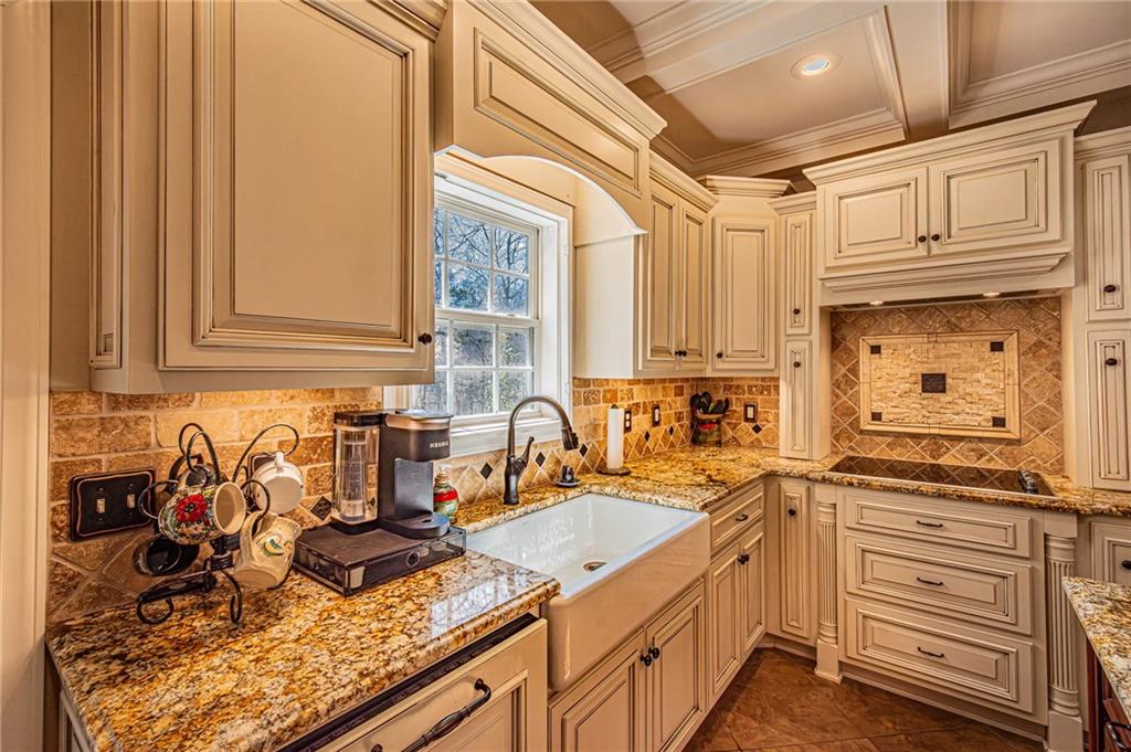 3718 Pebble Creek Point Gainesville, GA 30506 - Photo 8 of 144 a kitchen with stainless steel appliances granite countertop a sink stove and cabinets