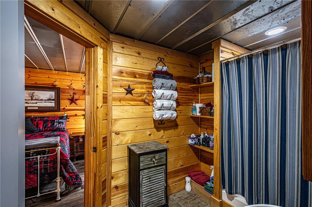 3718 Pebble Creek Point Gainesville, GA 30506 - Photo 88 of 144 a view of walk in closet with clothes